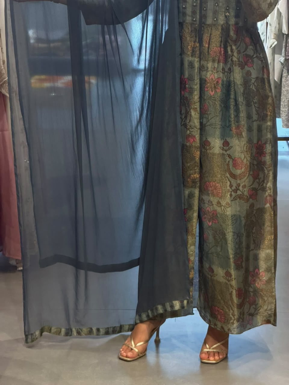 Floral Elegance – Issu Silk Gown with a Graceful Drape